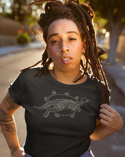 RUGBYNOMAD black color organic cotton women's streetwear t shirt on a female model standing with her hands in her pockets and nose ring with a gray australia wallaby artistic tribal design